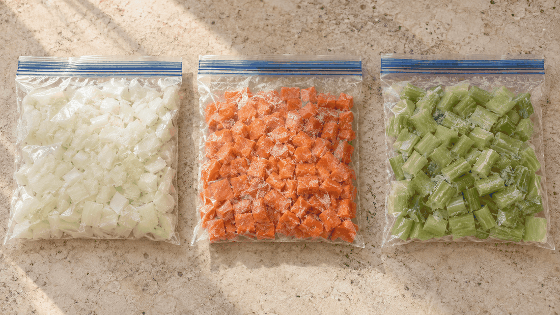 Freezer bags of diced onion, carrot and celery laid flat
